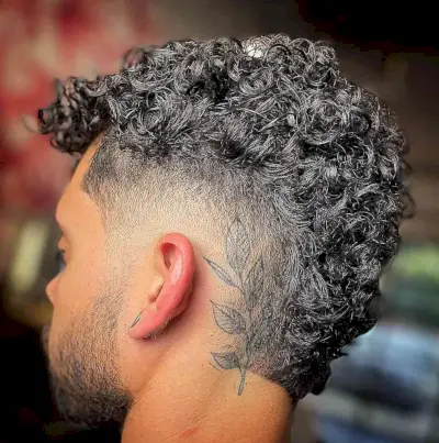 Voluminous Curls with Burst Fade Cut for Young Men