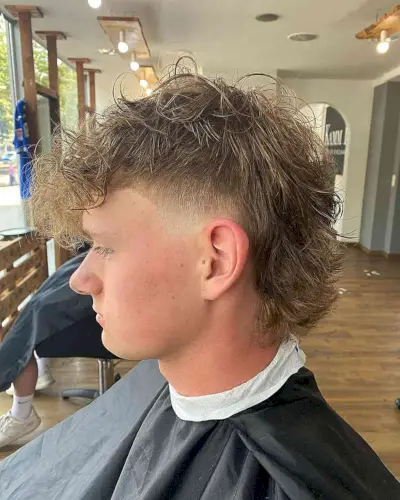 Mid-Length Messy Mohawk Burst Fade on Young Men