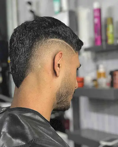Skin Burst Fade with Design on Guys with Thick Hair