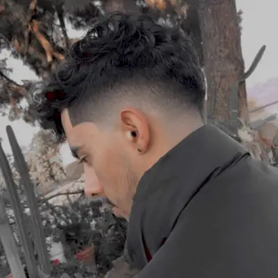 Drop fade undercut for men with curly hair