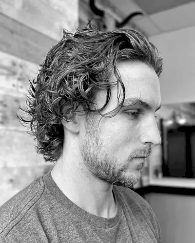 Swept Back Messy Wings Hairstyle for Men