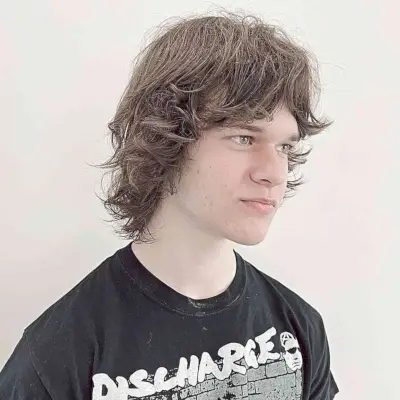 Winged Shaggy Razor Cut with Messy Waves for Young Boys