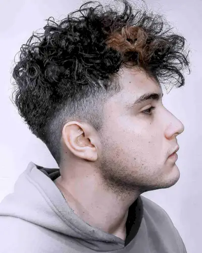 Choppy curls with an undercut fade