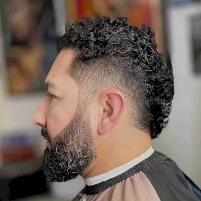 Bearded Fade on a Short Curly Mullet for Men