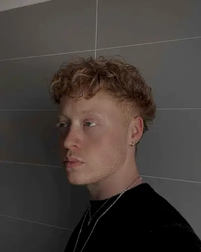 Temple Undercut on Curly Copper Hair for Guys