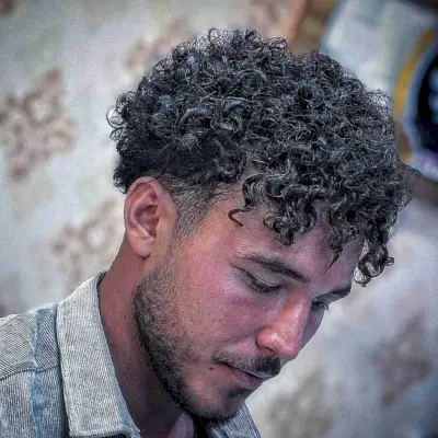 Piece-y Curly Bangs on Short Hair for Men