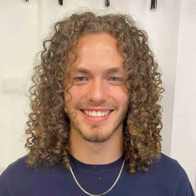 Middle Part Style on Long Blonde Curls for Men
