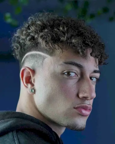 Disconnected Curly Cut with a Curved Razor Line for Men