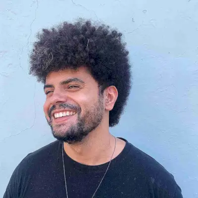 Long Afro Hair with a Mohawk Cut for Guys