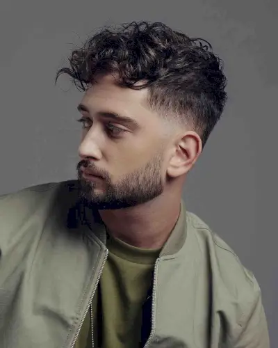 Loose Curly Hair with a Gradual Fade for Dudes