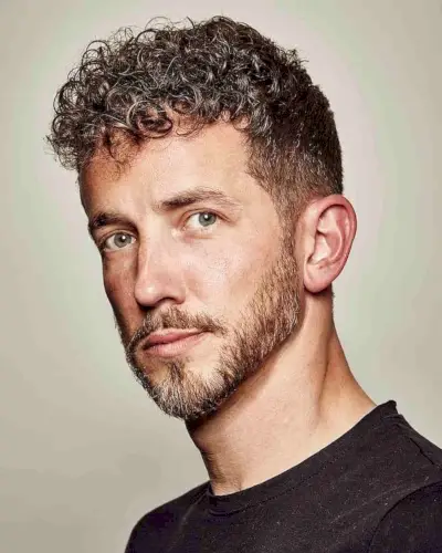 Messy Curly Top with Tapered Sides for Guys