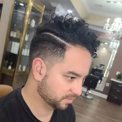 Curly wavy hair with hard part