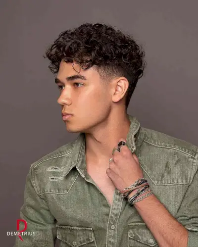 longer curly hair on top with short sides