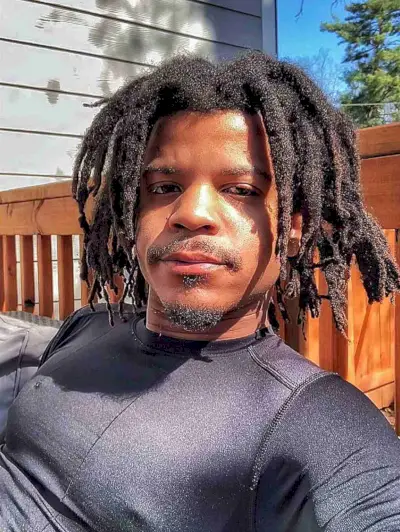 Face-Framing Middle Part Freeform Locs on Guys