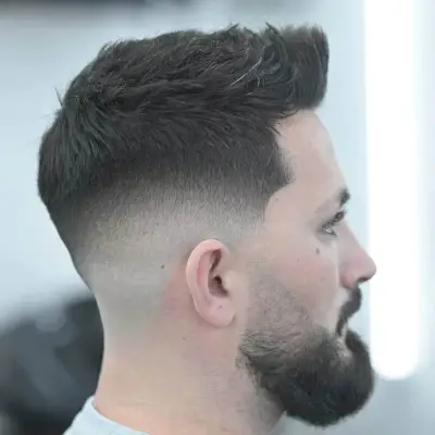 Mid taper fade cut with texture