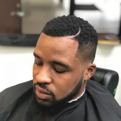 Tapered Afro hairstyle with Beard