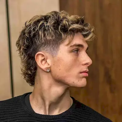 Mullet with Highlights and a Taper Fade for Dudes with longer hair on top