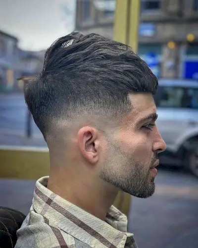 Simple drop fade cut for men with thicker hair and a beard fade
