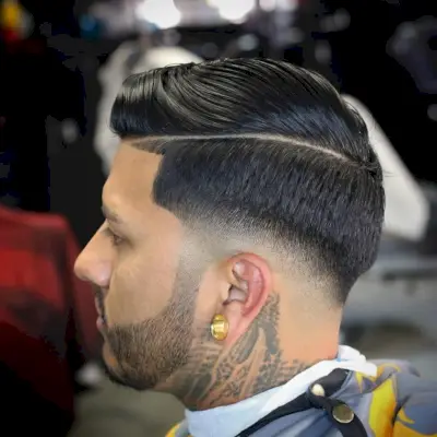 Slick comb over + low bald fade