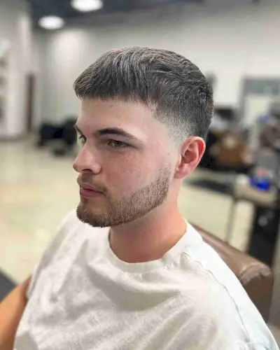 Faded Haircut with Short Fringe and Low Taper