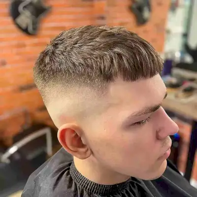 High Bald Fade with Textured Micro Bangs on Men
