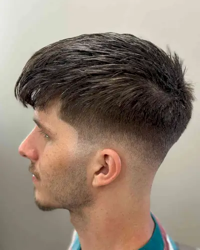 Low Drop Fade Cut with Razored Texture and Full Fringe for Men