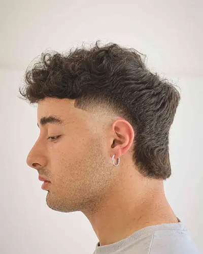 Modern Temp Fade on a Mullet Style for Guys with thick hair