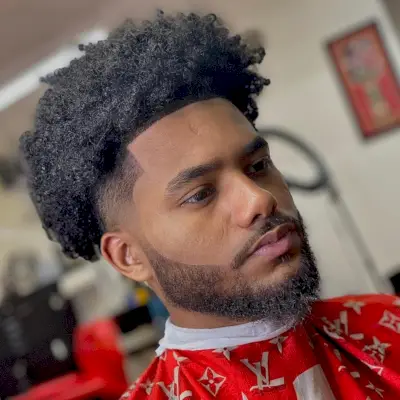 Fade with curly blowout haircut