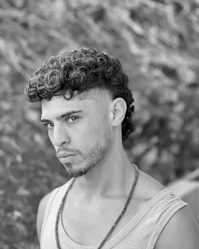 Mullet with a Curly Fade for Men