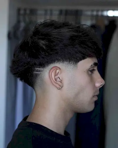 Low Taper with Shaved Designs on Men with Thick Hair