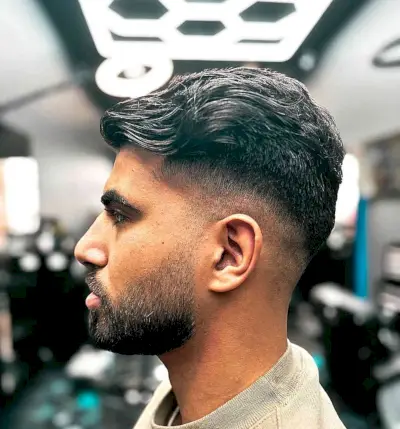 Wavy Modern Thick Mid-Fade Haircut with Beard for Men