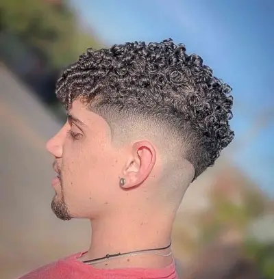 Short Side Bald Fade With Natural Twists for Thick Haired Men