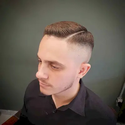 High-mid fade with shaved part