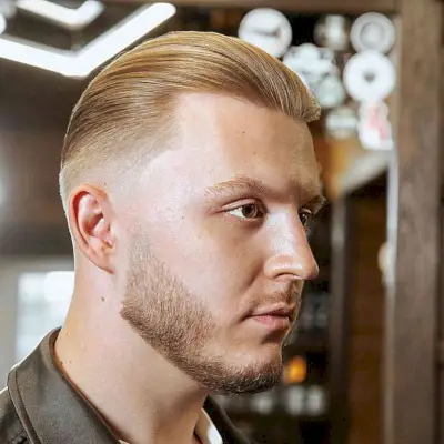 Slicked Back with a Mid Fade for Dudes with a beard and short sides