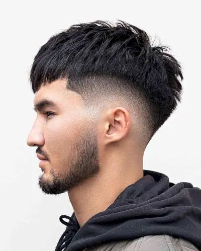 Mid Fade Edgar Cut with Piece-y Texture on Males with Straighter Hair