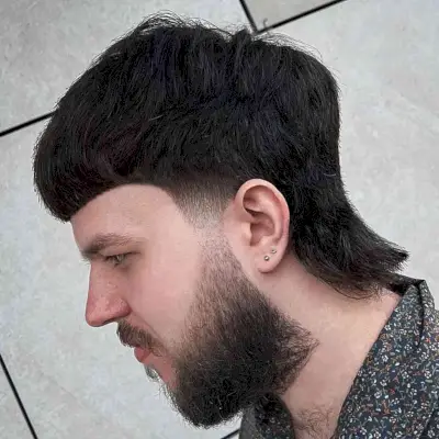 Thick Mullet with a Beard Fade for Guys