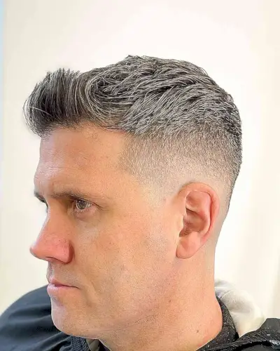 Grey Textured Top with Short Sides and Brushed-Up Bangs for Men Over 40