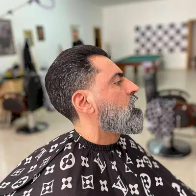 Combed Back with Low Tapered Fade and Beard on mature men with straight hair