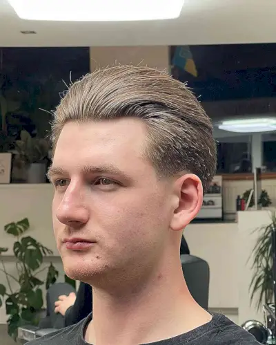 Brushed Back Style with Low Taper Fade for Young Guys with Straight Locks