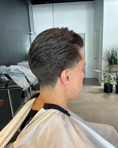 Sleek Layered Low Taper Fade Cut on guy