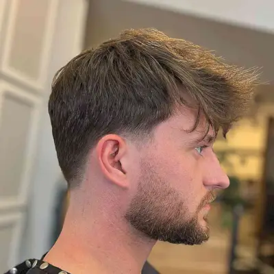 Natural Messy Top with Low Taper Fade for Men with Straight Locks