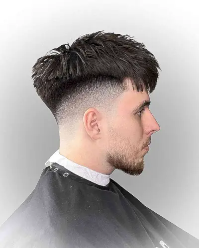 Dapper Fade Cut with Textured Bangs for Men