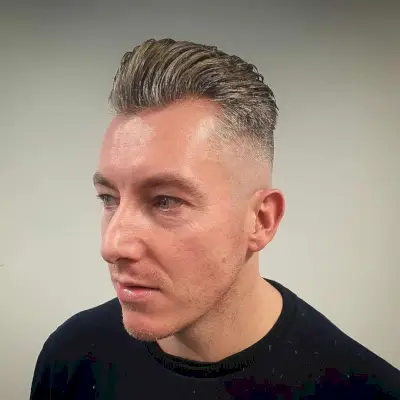 Slicked Back Short Hair with a Bald Fade for Men with Thin Hair