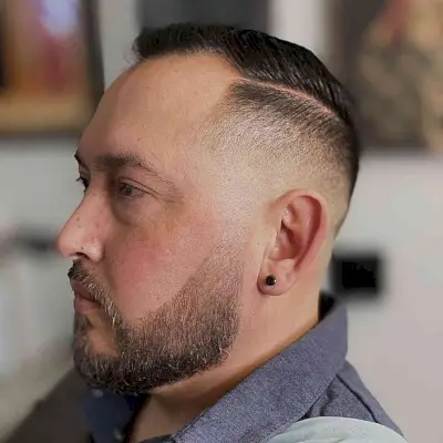 Straight and sleek haircut with a hard part for men with thin hair