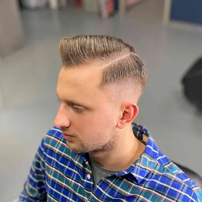 Deep Side Part with a Mid Fade for Guys with Thin Hair