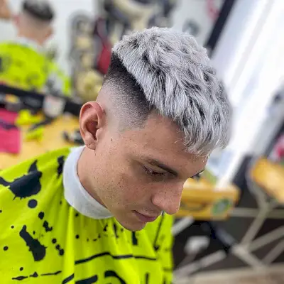 High Fade Cut with Frosted White Blonde Highlights on Men