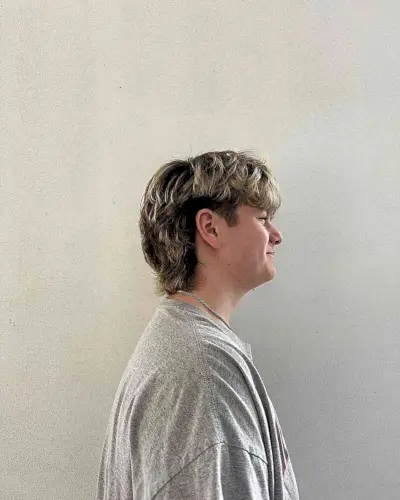 Grown-Out Medium Mullet Undercut with Frosted Highlights for Young Guys
