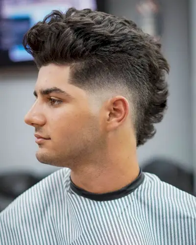 Low Burst Fade On Wavy Mohawk Hair
