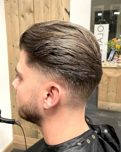 Low Tapered Fade and Slick Back Style on Brown Hair