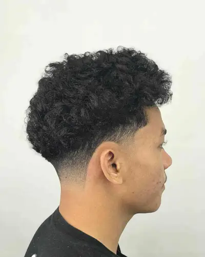 Fluffy French Crop with Low Fade for Men with Curly Hair